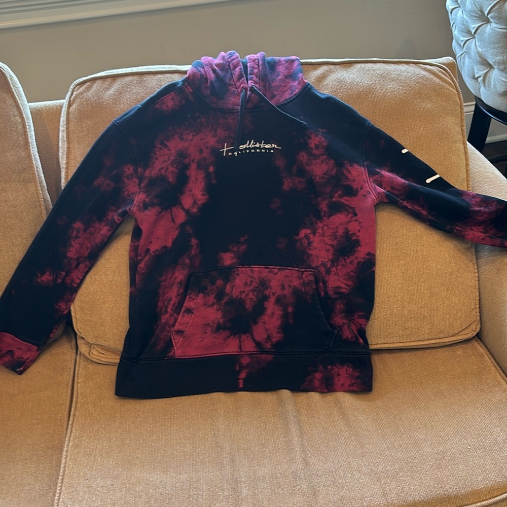 hi i am selling a size small black and red hoodie from hollister